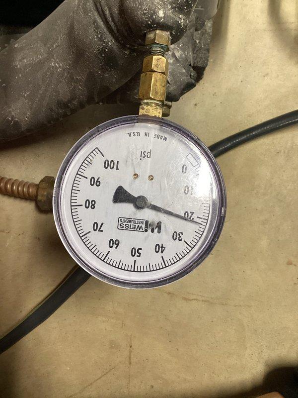 Performed loop conditioner installation and configuration for HVAC unit. Completed electrical connections at control panel, routing and securing multiple low-voltage and line-voltage conductors with proper cable management. Installed and verified pressure monitoring gauge reading 0-100 PSI range on system loop, confirming proper operation of source pump power supply rated at 5 HP 208-230V.