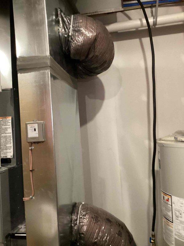 Returned to property to complete installation of whole home dehumidifier unit in mechanical room. Successfully installed Tempstar dehumidifier with all necessary ductwork connections, including flexible black supply duct integrated into existing HVAC system. Completed all electrical connections, installed condensate pump for drainage, ran PVC drain lines, and secured all refrigerant lines and wiring per manufacturer specifications. Unit tested and operational, providing proper humidity control for the entire home.