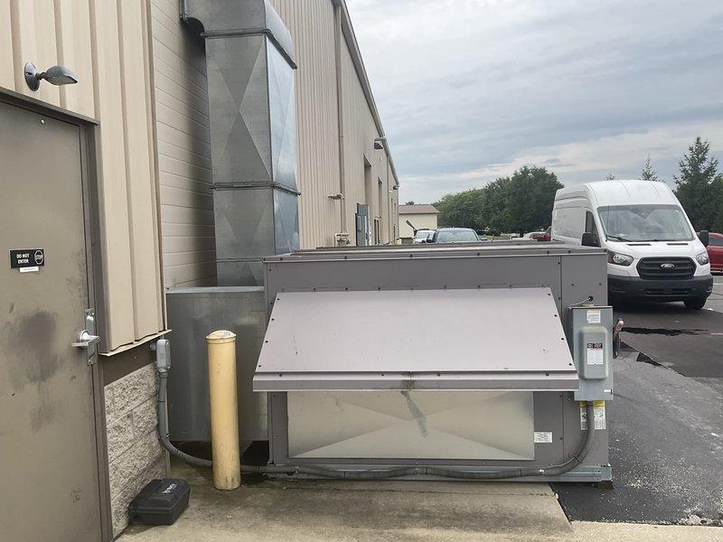 Completed estimate for replacement of ground-level commercial package HVAC unit located at exterior of facility. Unit assessed for full replacement due to system failure, with new equipment to be positioned on existing concrete pad with bollard protection. Estimate includes removal of existing unit, installation of replacement package system, reconnection of ductwork penetrating building envelope, and restoration of all connections to ensure proper operation.