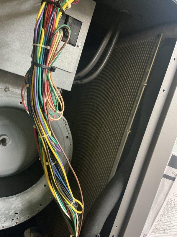 Completed basic monthly cooling maintenance visit on HVAC system. Performed visual inspection of blower motor assembly, evaporator coil, electrical connections, and refrigerant lines. All components found in good working condition with evaporator coil clean and free of debris, control wiring properly secured, and no visible signs of damage or deterioration noted.