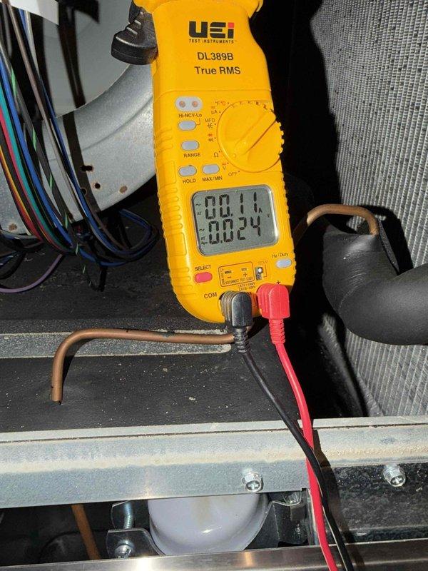 Completed comprehensive cooling maintenance service including inspection of evaporator coil which showed dust and debris accumulation between fins, and performed electrical diagnostics using digital multimeter to verify system amperage and voltage readings. All measurements were within normal operating parameters, and system components including refrigerant lines and condensate management were inspected and found to be functioning properly.