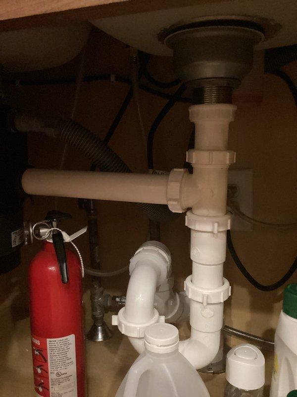 Completed annual plumbing inspection of residential property. Inspected and documented pressure tank system with pump assembly, including verification of pressure gauge operation, PVC piping connections, and shut-off valve functionality. Examined under-sink plumbing configuration, confirming proper P-trap installation and drain assembly integrity. All components found to be in satisfactory operating condition with no leaks detected at time of inspection.