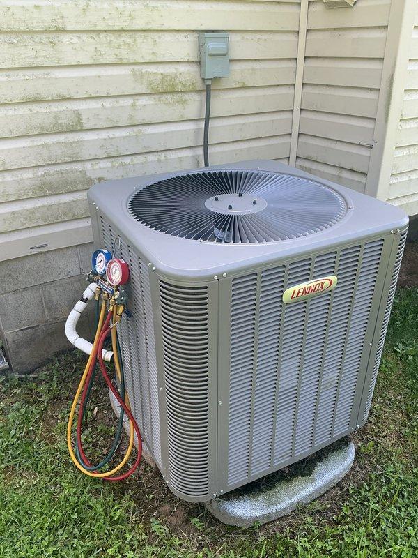 Completed annual cooling maintenance visit on Lennox air conditioning system. Performed standard inspection procedures including refrigerant pressure checks using manifold gauges, verified system operation, and inspected condenser unit exterior components. Provided pricing estimate for water heater flush service on A.O. Smith unit as requested by customer.