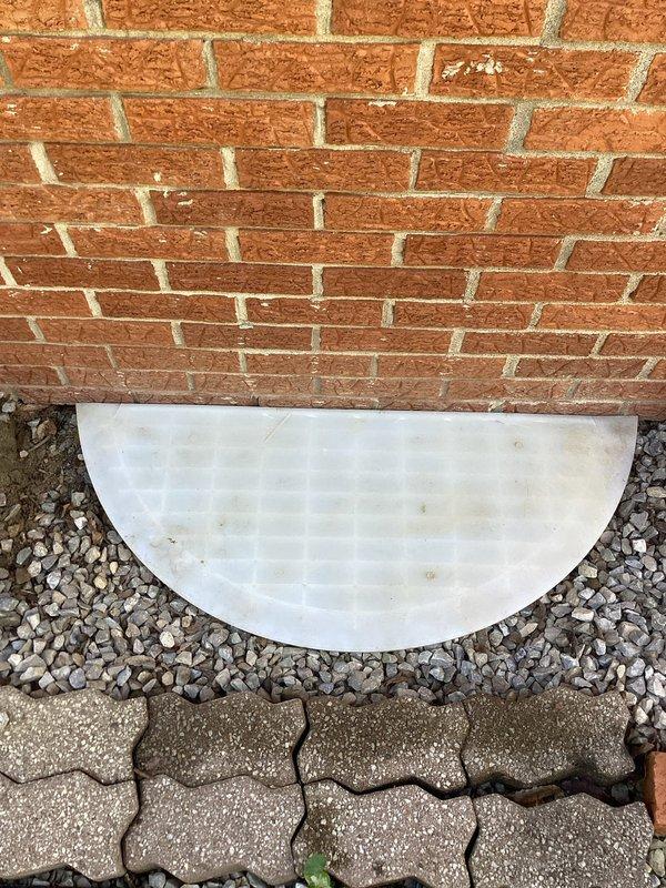 Responded to service request to inspect and verify operation of two sump pumps located in crawlspace. Accessed crawlspace through foundation entry point and located both sump pump units. Performed operational testing on both pumps to confirm functionality and proper discharge. Verified discharge lines were clear and draining properly to exterior of property. Inspected pump float switches, check valves, and electrical connections on both units. Documented existing conditions with photographs showing exterior discharge point with proper drainage away from foundation and crawlspace mechanical systems including pump installation and associated plumbing components. Both sump pumps confirmed to be in working order with no issues identified during inspection.
