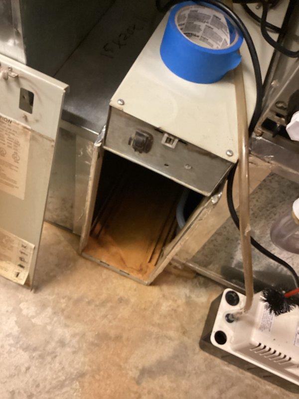Responded to callback for system not running after previous service visit. Upon arrival, found HVAC equipment in basement utility area with air handler installed in unfinished space with exposed framing and construction debris present. Inspected electrical panels and system controls, verified unit power supply and connections. Documented equipment conditions and installation environment with photos showing air handler with flex duct connections in partially completed construction area. Troubleshot system failure, identified and resolved issue preventing operation. Restored system to normal running condition and verified proper functionality before departure.