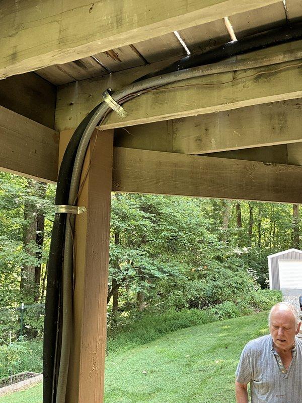 Completed comprehensive estimate for full HVAC system replacement with GOODMAN equipment at residential property. Assessed existing outdoor condenser unit currently installed beneath deck structure on gravel pad, evaluated electrical routing along deck beams, and documented site conditions including accessibility and clearance requirements for new equipment installation.