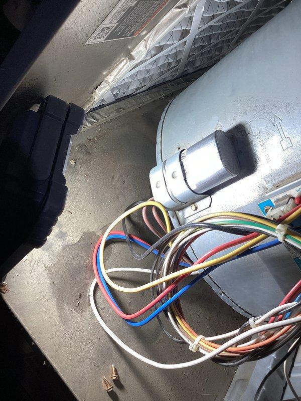 Responded to no-cooling call and performed diagnostic inspection of residential air conditioning system. Upon arrival, verified thermostat was set to cooling mode at 77°F and checked system operation. Inspected indoor air handler unit in attic space, examining electrical connections, ductwork, and control wiring. All wire bundles and connections at air handler appeared secure with no visible damage. Thermostat displaying proper temperature reading and responding to inputs with fan and system mode switches functioning correctly. Conducted visual inspection of accessible components including plenum connections and return air grille installation. System evaluated and operational status verified at time of service completion.