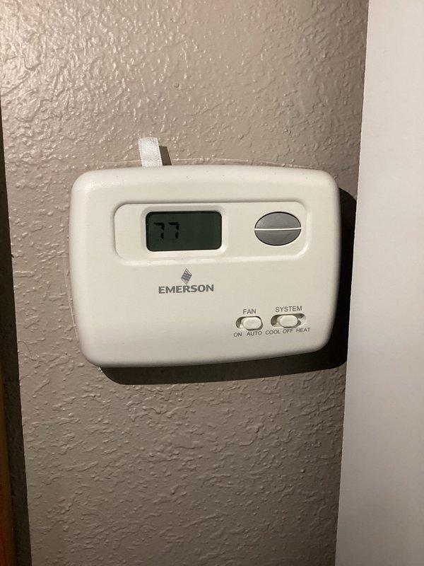 Responded to no-cooling call and performed diagnostic inspection of residential air conditioning system. Upon arrival, verified thermostat was set to cooling mode at 77°F and checked system operation. Inspected indoor air handler unit in attic space, examining electrical connections, ductwork, and control wiring. All wire bundles and connections at air handler appeared secure with no visible damage. Thermostat displaying proper temperature reading and responding to inputs with fan and system mode switches functioning correctly. Conducted visual inspection of accessible components including plenum connections and return air grille installation. System evaluated and operational status verified at time of service completion.
