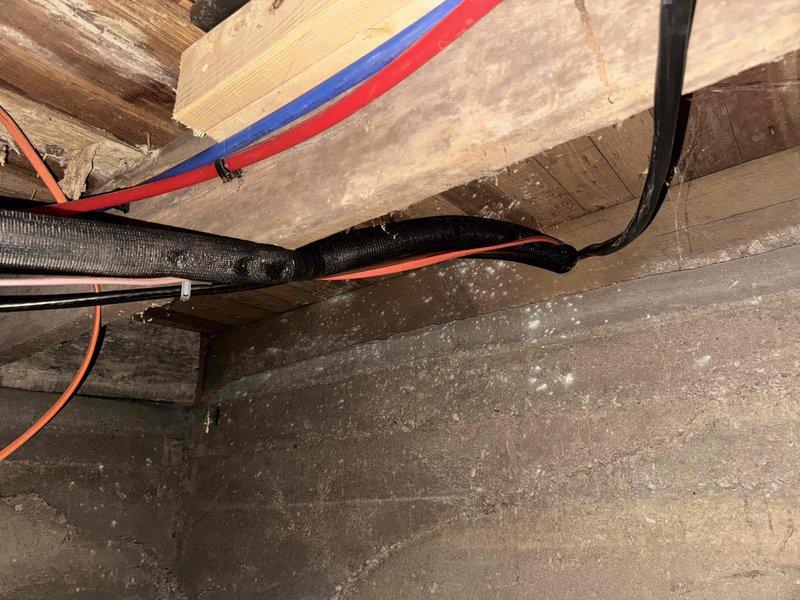 Completed installation of Lennox heat pump system model CBX45UHV045E-030-230-71 with air handler unit mounted in attic space. Installed dedicated electrical circuit wiring to support heat pump operation and stove, routing cables through attic framework and securing all electrical connections per manufacturer specifications and code requirements. System tested and verified operational at rated voltage parameters.