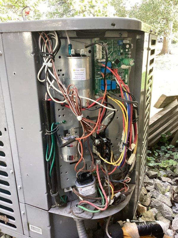 Responded to callback for non-operational HVAC system. Upon arrival, performed electrical diagnostics using digital multimeter to measure amperage and voltage at outdoor unit components. Readings indicated 0.85A draw with minimal voltage present. Inspected control board, capacitors, contactor, and associated wiring connections within outdoor condensing unit. Documented equipment condition and electrical measurements with photos for service records. System required further troubleshooting to identify root cause of repeated failure following previous service visit.