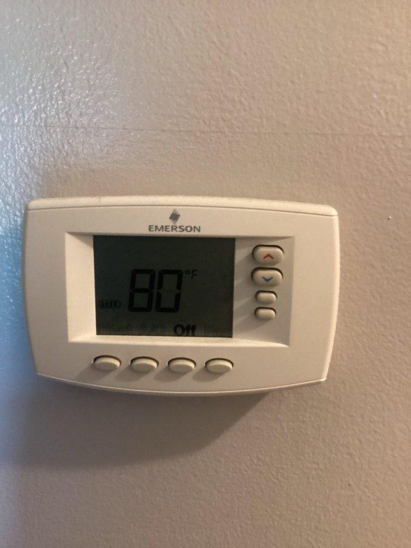 Responded to emergency no cooling call. Upon arrival, found thermostat displaying 80°F and in OFF position. Inspected furnace/air handler unit in utility area and verified system was not receiving call for cooling. Diagnosed thermostat malfunction preventing proper system operation. Replaced faulty thermostat with new unit, restored power, and tested system through complete cooling cycle. Verified proper communication between thermostat and HVAC equipment, confirmed adequate airflow, and ensured all safety controls functioning correctly. System now operating normally with cooling restored.