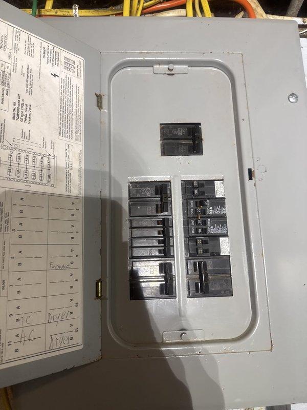Inspected and documented electrical panel and pump control system. Panel examination revealed standard residential circuit breaker configuration with properly labeled circuits including HVAC, furnace, dryer, and A/C systems. Photographed pump control panel housing with reset mechanism and verified accessibility of all components for future maintenance requirements.