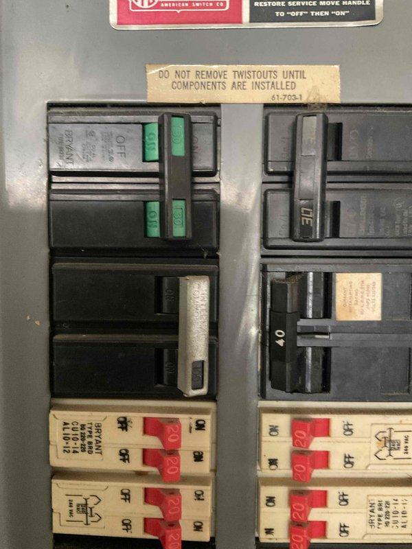 Conducted site evaluation for mini-split installation in upstairs area of property where main HVAC system was previously installed. Assessed existing electrical panel capacity and photographed breaker box configuration to determine available circuits and amperage for new mini-split system power requirements.