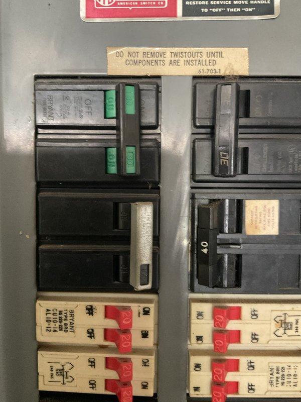 Conducted site evaluation for mini-split installation in upstairs area of property where main HVAC system was previously installed. Assessed existing electrical panel capacity and photographed breaker box configuration to determine available circuits and amperage for new mini-split system power requirements.