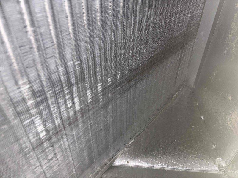 Completed scheduled heating maintenance tune-up on 16-year-old Carrier system. Performed comprehensive inspection of indoor evaporator coil assembly, noting visible dust accumulation between fins and minor debris buildup in drain pan area. Inspected outdoor condensing unit, confirming proper placement on concrete pad with adequate clearance from structure. Unit showed normal weathering for age with all components operational. Verified system readiness for heating season per manufacturer maintenance specifications.