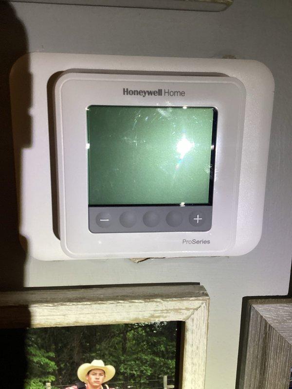 Responded to callback for non-operational HVAC system following recent maintenance visit where capacitor was replaced. Upon arrival, verified thermostat settings and confirmed system status, observing display showing 71° current temperature with cooling setpoint of 75° and fan operation active. Documented equipment conditions for service records.
