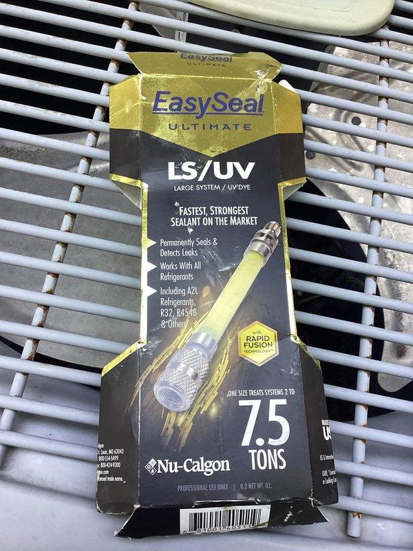 Returned to property to add refrigerant to the Carrier system as scheduled. Applied EasySeal ULTIMATE LS/UV sealant (7.5 ton capacity) to permanently seal detected leaks in the refrigeration circuit. Recharged system with appropriate refrigerant to manufacturer specifications. Verified thermostat operation and confirmed system cycling properly in auto mode with correct temperature setpoints.
