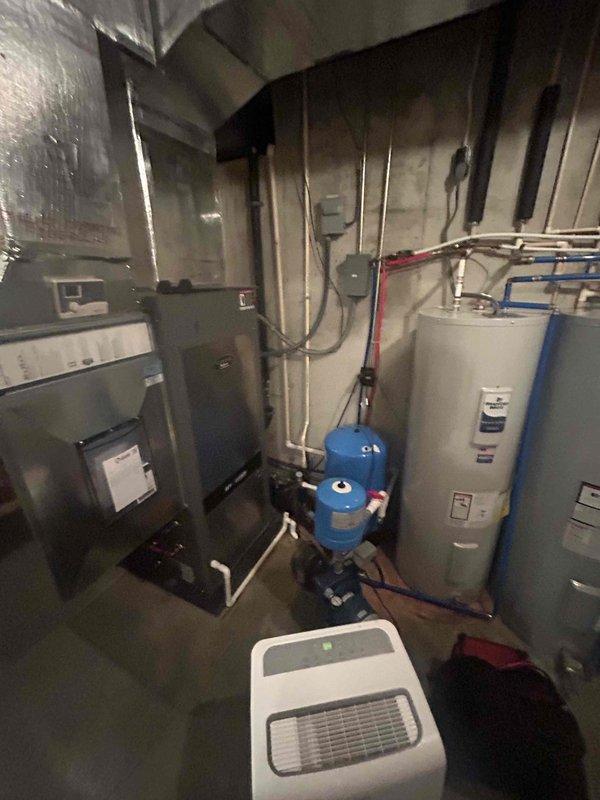 Completed annual basic cooling maintenance visit on residential HVAC system located in basement utility area. Performed standard preventive maintenance procedures including inspection of furnace/air handler unit, ductwork, and associated equipment. All components found operating within normal parameters; system ready for cooling season operation.