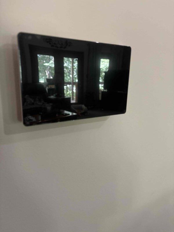 Completed full HVAC system installation including Lennox air conditioning unit and gas furnace. Installed new digital touchscreen thermostat on interior wall for system control and programming. Mounted exterior electrical disconnect box with proper conduit routing and secured all electrical connections per code requirements.