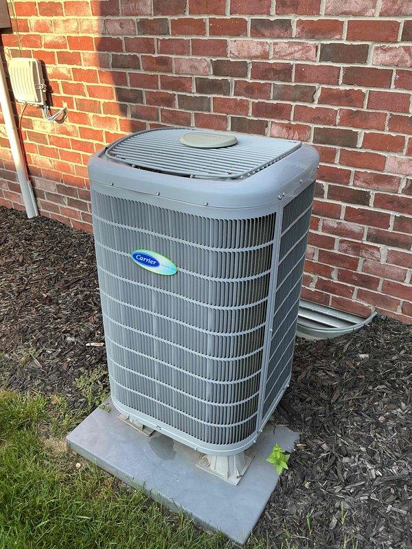 # HVAC Maintenance - Cooling System Service

Completed comprehensive cooling maintenance on Carrier outdoor condensing unit, serial number 4820E10287. Performed standard preventive maintenance procedures including inspection of electrical connections, refrigerant levels, and overall unit operation. Documented equipment condition through photographs showing unit positioned on concrete pad with proper clearances maintained. Verified condenser coils, fan operation, and external components functioning within normal parameters. Unit exterior showing typical wear consistent with age and outdoor exposure. Electrical disconnect and line set connections inspected and found secure. Mulch bed surrounding unit maintained with adequate drainage. Service completed per Basic Monthly maintenance agreement specifications. Customer advised that 20x20x4 filter not included in service and requires separate replacement by homeowner.