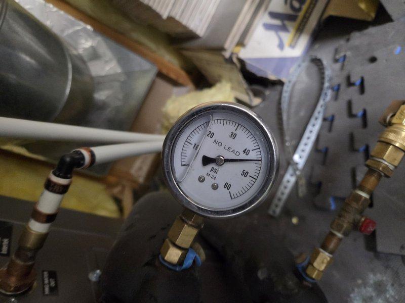 Responded to service call for geothermal system with low water pressure. Upon inspection, system pressure gauge reading approximately 0 PSI, indicating significant loss of system fluid. Assessed geothermal loop connections, pressure gauge, and associated plumbing components for leaks or system integrity issues. Scheduled return visit to properly fill and pressurize the geothermal system to manufacturer specifications and verify system operation.