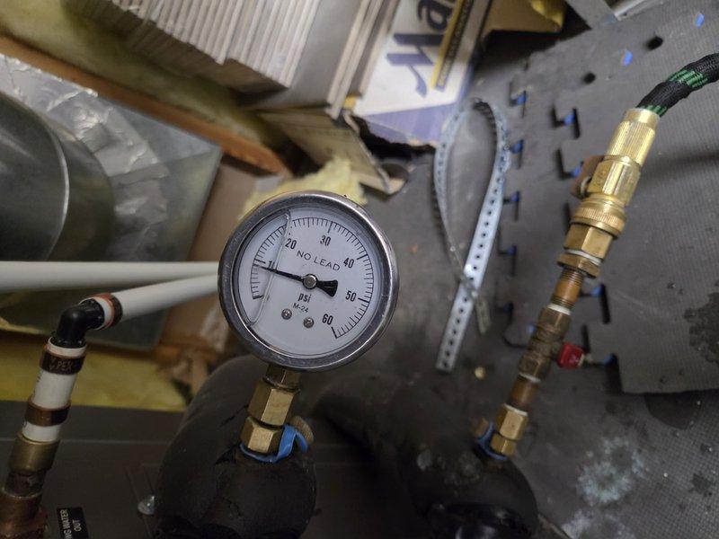 Responded to service call for geothermal system with low water pressure. Upon inspection, system pressure gauge reading approximately 0 PSI, indicating significant loss of system fluid. Assessed geothermal loop connections, pressure gauge, and associated plumbing components for leaks or system integrity issues. Scheduled return visit to properly fill and pressurize the geothermal system to manufacturer specifications and verify system operation.