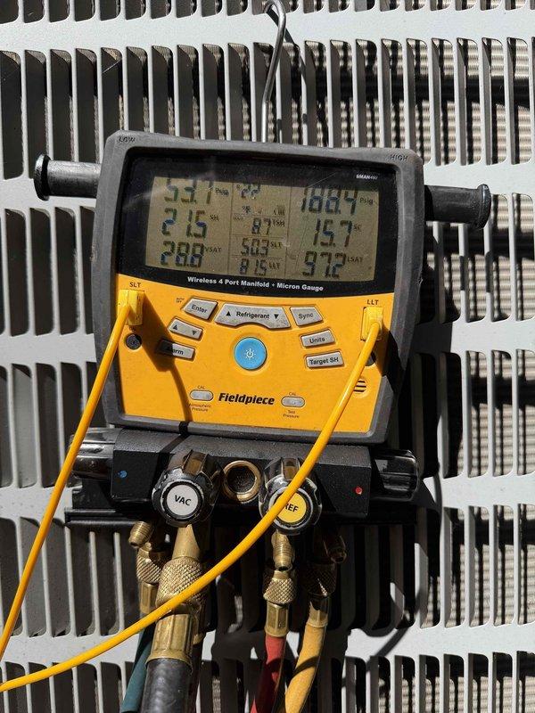 Responded to system overcharge condition. Connected manifold gauges to measure refrigerant pressures and temperatures, confirming excessive charge levels outside manufacturer specifications. Recovered surplus refrigerant using reclaim equipment to bring system back to proper operating pressures. Verified final pressures and superheat readings to ensure optimal system performance and prevent potential compressor damage from liquid floodback.