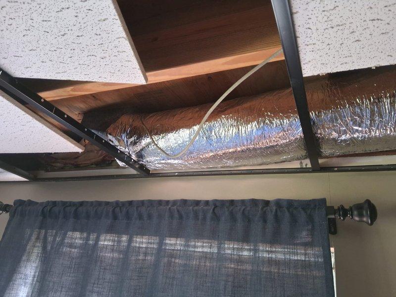 Completed ductwork renovation by removing existing metal duct system and installing 9 feet of 6-inch flexible duct in ceiling space. Secured new flex duct between structural joists with proper support and insulation, ensuring adequate airflow through the modified HVAC distribution system.