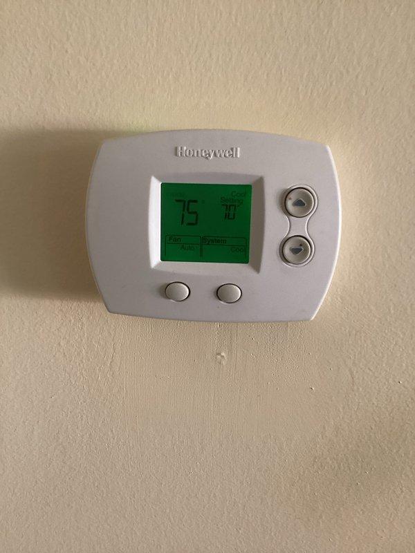 Replaced defective metering device piston for the air conditioning system to restore proper refrigerant flow and system operation. Upon completion, verified thermostat functionality and confirmed accurate temperature readings and control settings. System tested and operating within normal parameters.