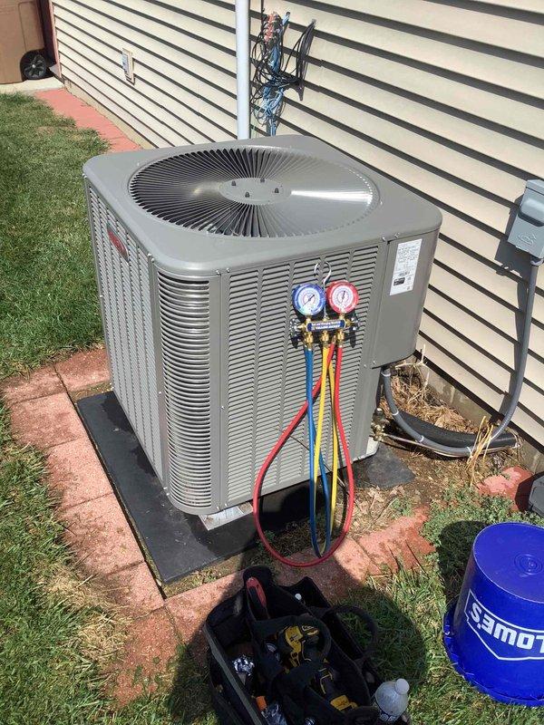 Completed preventive maintenance on 2-year-old residential air conditioning system. Performed comprehensive AC tune-up including inspection of outdoor condenser unit, verified refrigerant pressures using manifold gauge set, cleaned condenser coils, and checked electrical connections. Inspected Honeywell Home T6 Pro Smart thermostat operation, confirmed proper system communication and temperature control functionality set at 72 degrees cooling setpoint. System operating within normal parameters with no deficiencies noted. Verified customer contact information for future service needs.