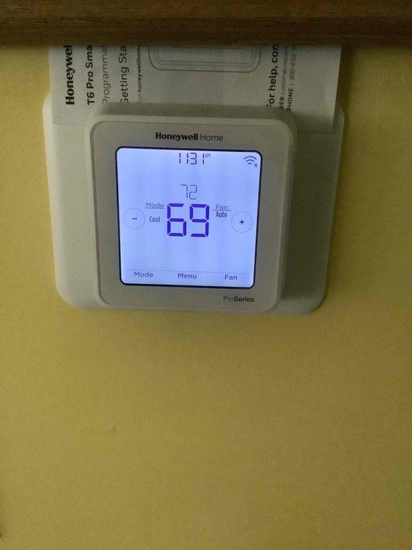 Completed preventive maintenance on 2-year-old residential air conditioning system. Performed comprehensive AC tune-up including inspection of outdoor condenser unit, verified refrigerant pressures using manifold gauge set, cleaned condenser coils, and checked electrical connections. Inspected Honeywell Home T6 Pro Smart thermostat operation, confirmed proper system communication and temperature control functionality set at 72 degrees cooling setpoint. System operating within normal parameters with no deficiencies noted. Verified customer contact information for future service needs.