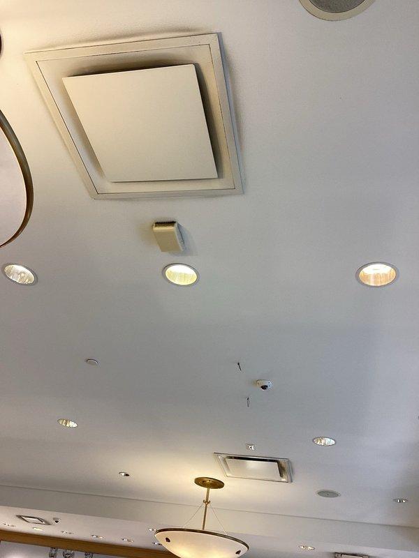 Conducted on-site assessment for duct cleaning service and documented current conditions of HVAC air distribution system. Inspection revealed significant dust and particulate accumulation on ceiling-mounted supply diffusers and surrounding areas, indicating need for comprehensive duct cleaning to improve indoor air quality and system efficiency.