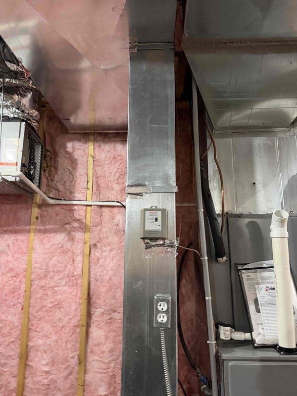 Returned to property to upsize the existing return air ductwork to 30x10 dimensions to improve system airflow and performance. Installed two sections of 30x10 trunk ductwork in the basement mechanical space, connecting to the existing HVAC system. Modified the return air pathway to accommodate the larger duct size, ensuring proper integration with the white furnace/air handler unit and existing galvanized metal ductwork in the unfinished utility area.