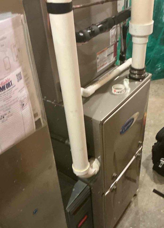 Completed comprehensive maintenance service on residential split HVAC system including both indoor furnace unit and outdoor condensing unit. Performed standard heating and cooling system inspection in basement utility area, checking furnace operation, PVC condensate drainage, and air handler components. Proceeded to outdoor unit where refrigerant pressures were measured and recorded using manifold gauge set, verifying system charge levels and operational parameters. Conducted electrical diagnostics with digital multimeter to ensure proper voltage and amperage readings across system components. All equipment found operating within manufacturer specifications with no deficiencies noted requiring immediate correction.
