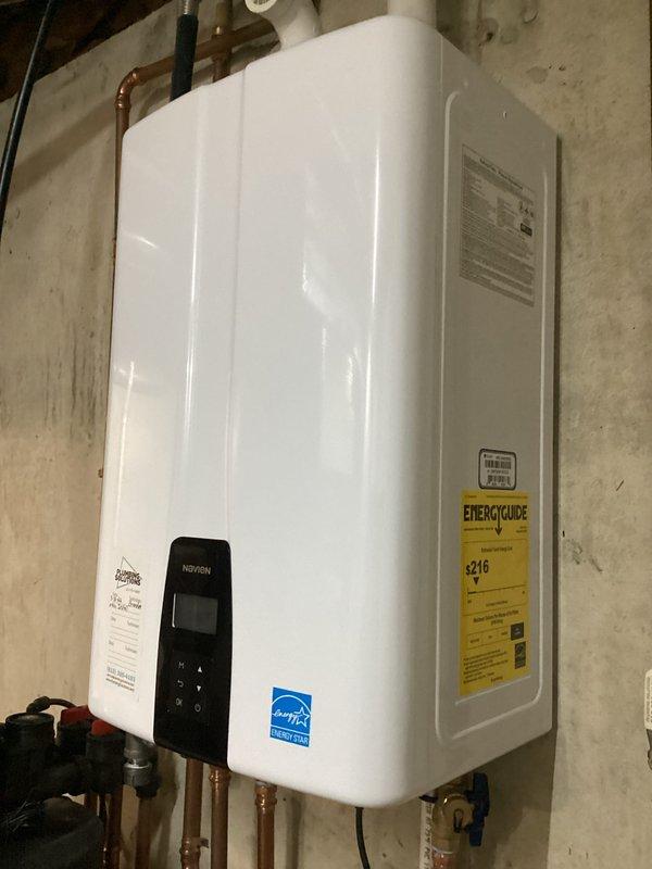 Completed yearly maintenance and tune-up on 19-year-old Florida Heat Pump geothermal system. Performed comprehensive inspection of heat pump components, verified thermostat operation showing proper temperature control set to 70 degrees, and confirmed system cycling functions correctly. Inspected associated Navien tankless water heater installation, verified all connections, and ensured integrated system components are operating within normal parameters for continued efficient performance.