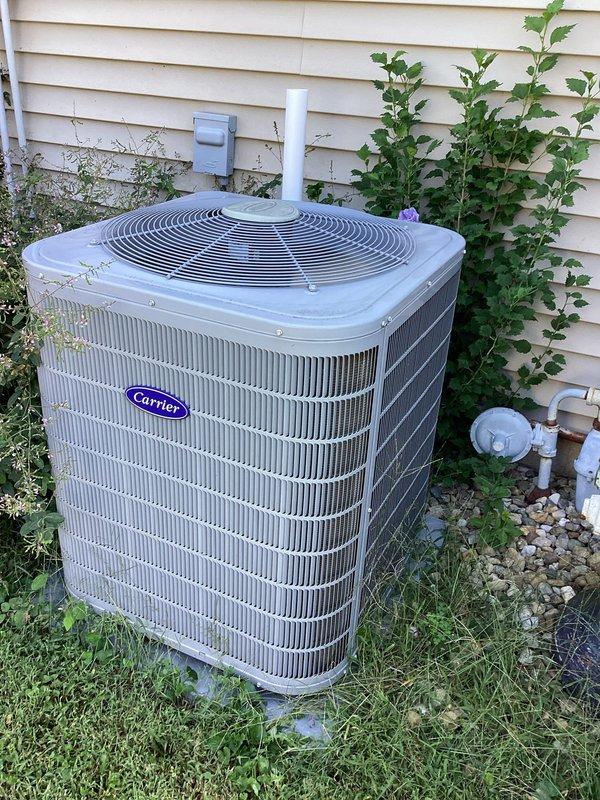 Responded to customer complaint of inadequate cooling and rising indoor temperatures requiring continuous high fan operation. Performed diagnostic inspection of Carrier split system air conditioning unit, including examination of outdoor condensing unit and indoor air handler components in attic space. Documented existing equipment conditions and system configuration for service records.