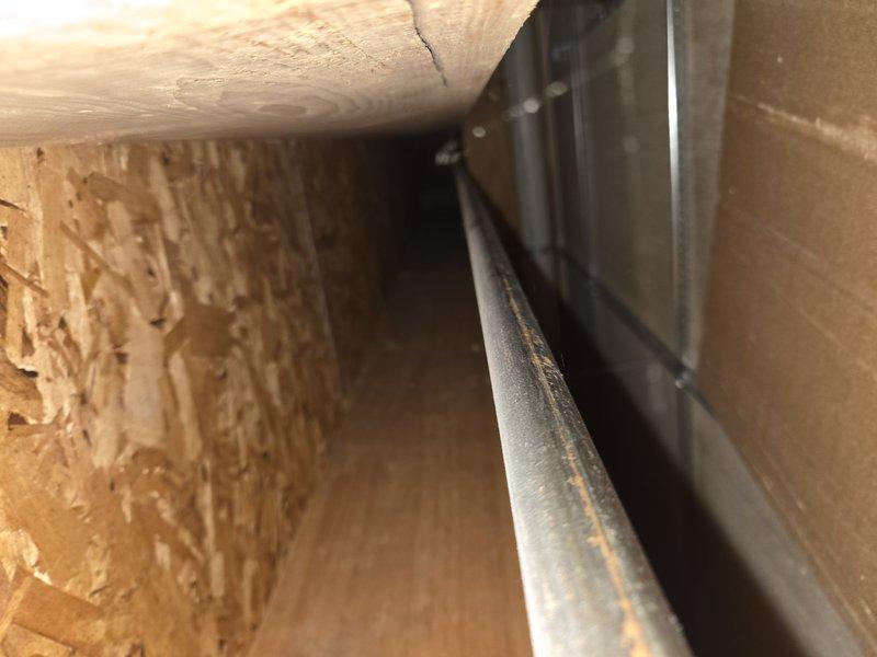 Responded to customer complaint of inadequate cooling and rising indoor temperatures requiring continuous high fan operation. Performed diagnostic inspection of Carrier split system air conditioning unit, including examination of outdoor condensing unit and indoor air handler components in attic space. Documented existing equipment conditions and system configuration for service records.