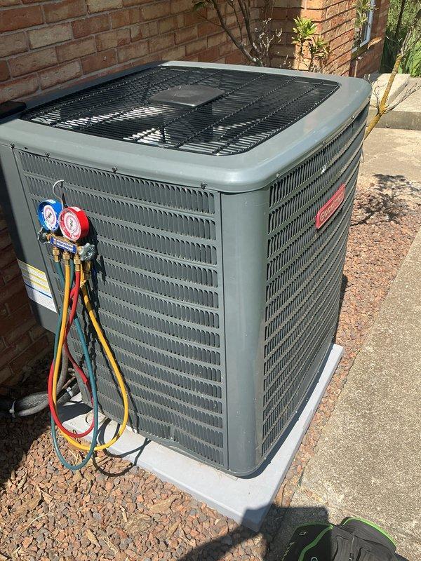 Completed basic monthly cooling maintenance visit on CCHP system. Inspected indoor air filter unit, noting existing 18x20x1 Filtrete filter in east location with west filter position marked as 14x20x1 size. Performed outdoor condenser unit inspection and attached manifold gauges to measure refrigerant pressures and verify system operating parameters. All routine maintenance checks completed per monthly service protocol.