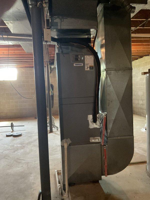 Conducted comfort consultation and system evaluation for aging HVAC equipment requiring consideration of full system replacement versus repair costs. Assessed existing vertical furnace/air handler in basement and outdoor condensing unit, documented current equipment condition with photographs, and prepared comprehensive replacement options for homeowner review.