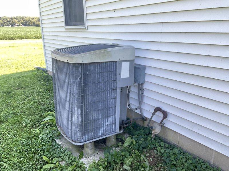 Conducted comfort consultation and system evaluation for aging HVAC equipment requiring consideration of full system replacement versus repair costs. Assessed existing vertical furnace/air handler in basement and outdoor condensing unit, documented current equipment condition with photographs, and prepared comprehensive replacement options for homeowner review.