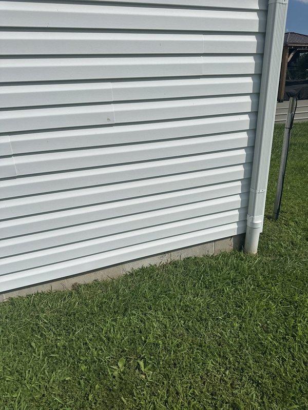 Conducted free estimate for installation of propane gas line to stove at residential property. Assessed exterior routing options along building perimeter with white vinyl siding, evaluating optimal path for gas line installation from propane source to kitchen appliance location. Documented site conditions and measurements for preparation of detailed proposal.