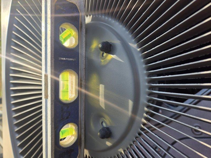 Responded to service call regarding unlevel outdoor condenser unit. Upon arrival, verified unit was significantly out of level using torpedo level across top panel and housing. Adjusted unit positioning and leveling to restore proper alignment, ensuring optimal compressor operation and refrigerant flow. Unit now sits level and stable on pad.