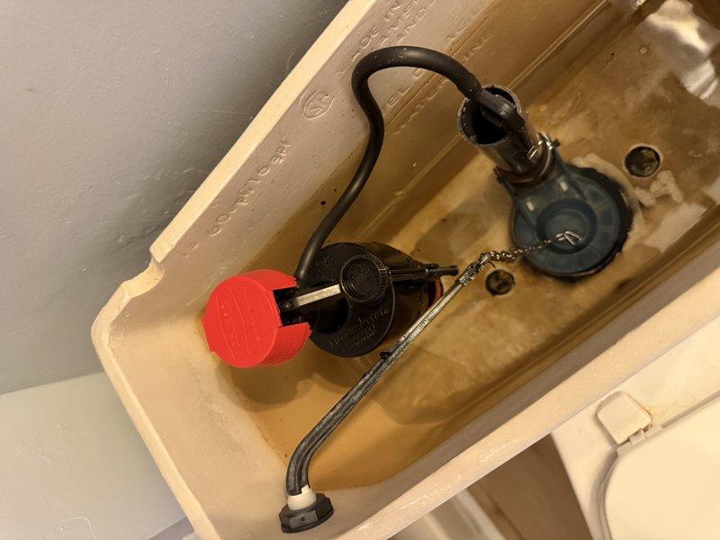 Responded to downstairs bathroom for toilet leaking and spraying water from tank area. Upon inspection, identified faulty fill valve assembly causing water to spray from top of tank during fill cycle. Removed tank lid, diagnosed issue with fill valve mechanism and refill tube connection. Replaced defective fill valve assembly with new unit, reconnected refill tube to overflow pipe, and adjusted water level to proper fill line. Tested flush cycle multiple times to verify proper operation with no leaks or spray. Toilet now functioning correctly with no water escaping from tank.