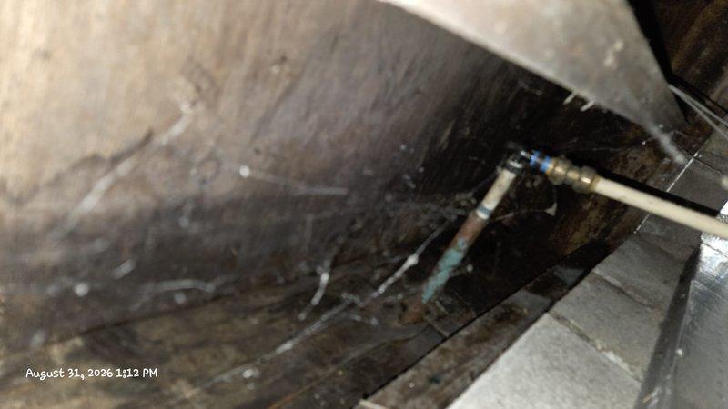 Responded to water leak in crawl space originating from spout connection. Upon inspection, identified leaking fitting with blue collar connection on beige pipe near HVAC system causing water infiltration and damage to crawlspace area. Repaired leaking water spout connection to eliminate active leak. Inspected surrounding area including Santa Fe Compact dehumidifier unit and confirmed proper operation of humidity control system to mitigate moisture issues. Documented existing water damage to wooden floor slats and surrounding areas for customer awareness.