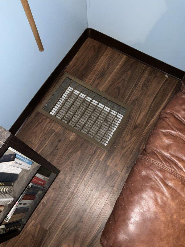 Performed diagnostic assessment on cooling system experiencing inadequate airflow due to insufficient return air. Evaluated existing return air configuration and documented measurements for additional return air grilles needed to resolve system starvation issue. Photographed current floor register locations and prepared estimate for installation of supplemental return air pathways to restore proper system performance.
