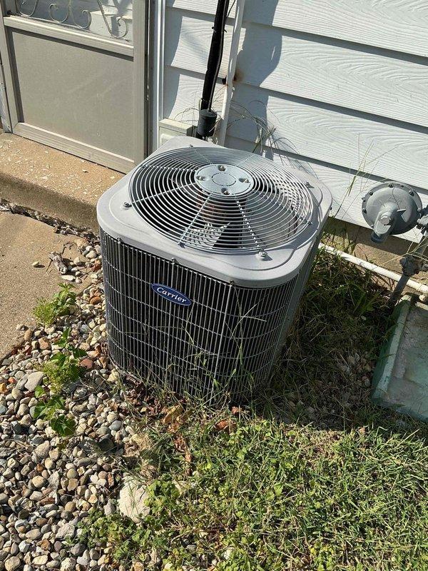 Responded to service call for air conditioning system with outdoor fan running but no cooling and thermostat operational issues. Upon arrival, performed diagnostic testing of the outdoor condensing unit using digital multimeter to verify electrical supply and component functionality, measuring voltage at 385V. Inspected condenser unit exterior condition, refrigerant line connections, and electrical conduit routing. Based on customer report that thermostat would not stay on and visual inspection findings, determined thermostat malfunction was preventing proper system operation and cooling cycle initiation.