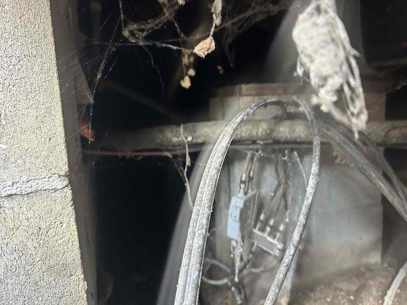 Responded to service call for leaking condensate drain line in crawlspace causing excessive moisture and odor issues throughout the residence. Upon inspection, discovered the condensate tube from the air conditioning system installed three years prior was actively leaking, creating constant dampness in the crawlspace with visible moisture accumulation on ductwork and surrounding surfaces. Documented existing conditions including significant dust buildup, crystalline deposits on HVAC components, and moisture damage to crawlspace area. Addressed the condensate drainage issue to eliminate ongoing water intrusion and prevent further moisture-related problems and odors in the living space.