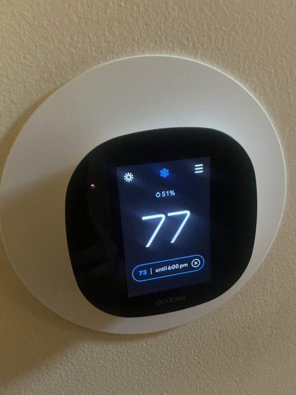 # HVAC Maintenance - Heating System

Completed basic monthly heating maintenance visit on residential HVAC system. Performed standard heating system inspection including visual assessment of furnace components, electrical connections, and control systems. Verified ecobee smart thermostat operation showing proper temperature control at 77°F with humidity reading of 51% and scheduled setpoint of 73°F until 6:00 PM. 

Inspected furnace interior components including blower motor assembly, electrical relay/contactor connections, and associated wiring. All electrical connections including red, white, green, yellow, pink, and brown wires were secure and properly terminated. Blower motor and capacitor assembly showed normal operation with manufacturer labels intact and barcode identification visible.

**Important Note for Future Service:** Filter maintenance required - technician must clean filter on next visit as specified in service protocol. Electronic air cleaner (EAC) filter not included 