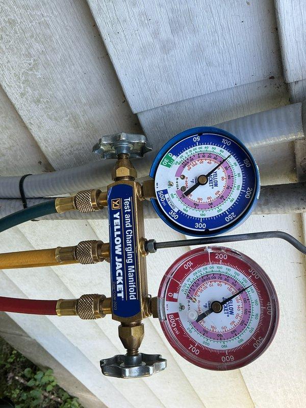 Completed comprehensive cooling maintenance visit including CCC basic monthly service. Installed new 20x20x1 air filter, performed system diagnostics using manifold gauge set to verify refrigerant pressures and overall system performance. Outdoor condenser unit inspected and confirmed operational, though vegetation growth noted around concrete pad perimeter requiring future attention for optimal airflow clearance.