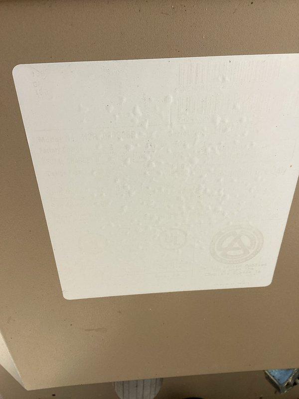 Responded to service call regarding dehumidifier in crawlspace continuing to run. Performed system inspection of outdoor Maytag condenser unit and verified proper operation. Documented equipment condition with photos showing condenser unit positioned on concrete pad with proper clearances and crawlspace access panel in ceiling. Unit found operating within normal parameters with no immediate service needs identified.